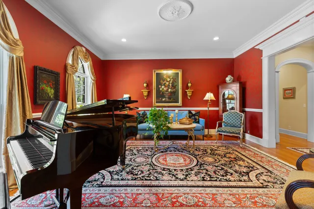 a living room with stainless steel appliances kitchen island granite countertop furniture and a kitchen view