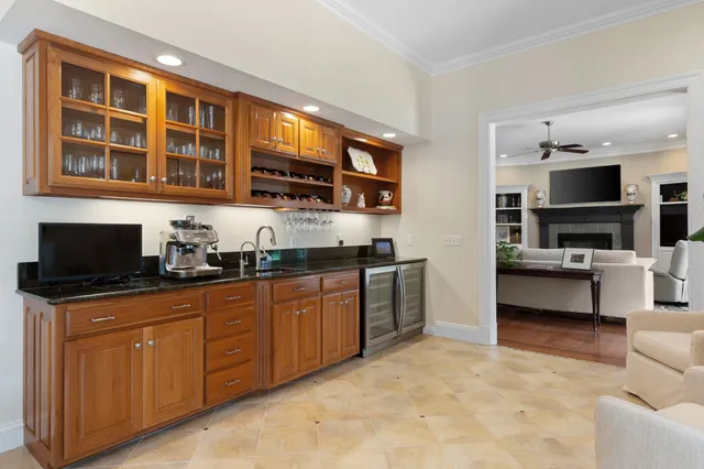 a view of a dining room with furniture and chandelier