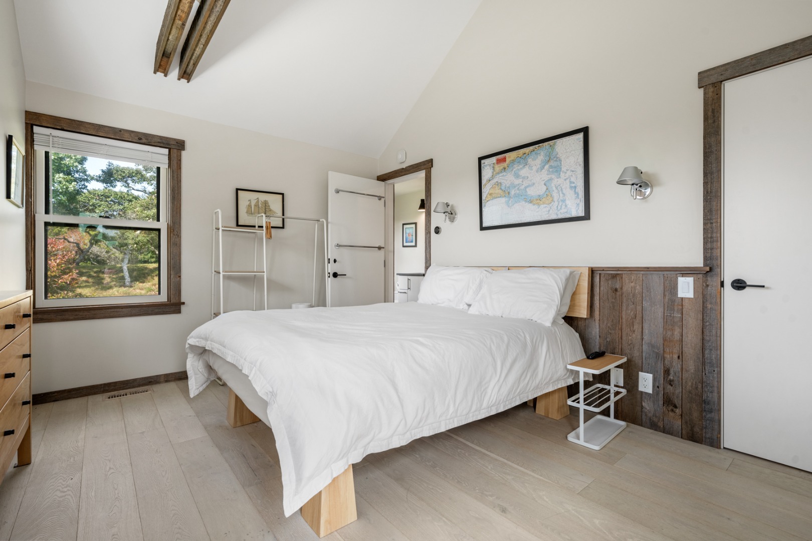 247 Polpis Road Nantucket, MA 02554 - Photo 47 of 52 a bedroom with a bed and a window