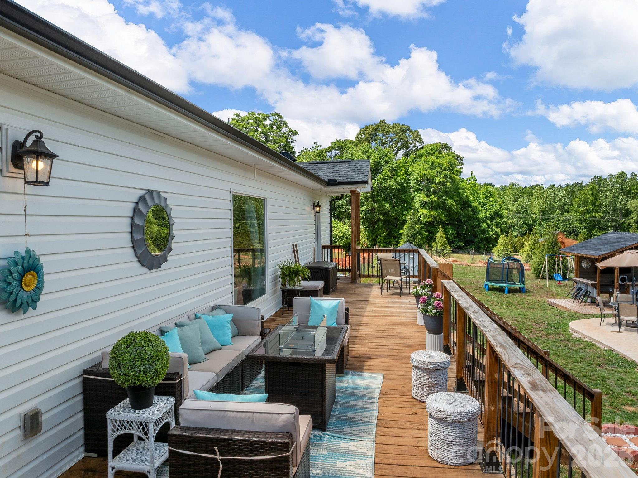 1076 McSwain Road Chesnee, SC 29323 - Photo 28 of 36 a balcony with furniture and a potted plant