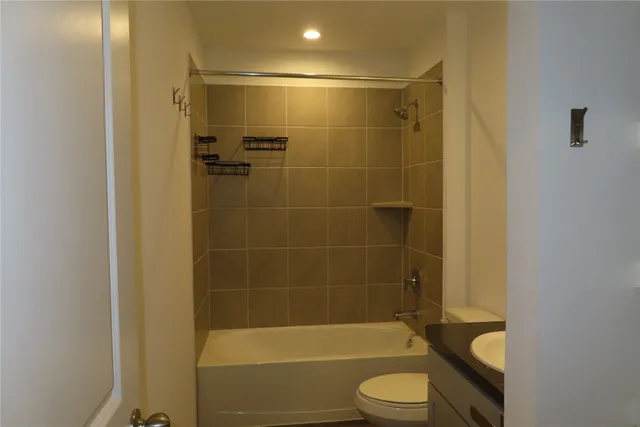 a bathroom with a shower and a toilet