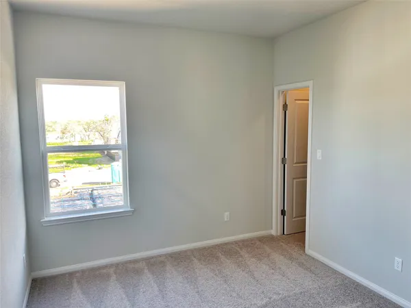 a view of an empty room and window