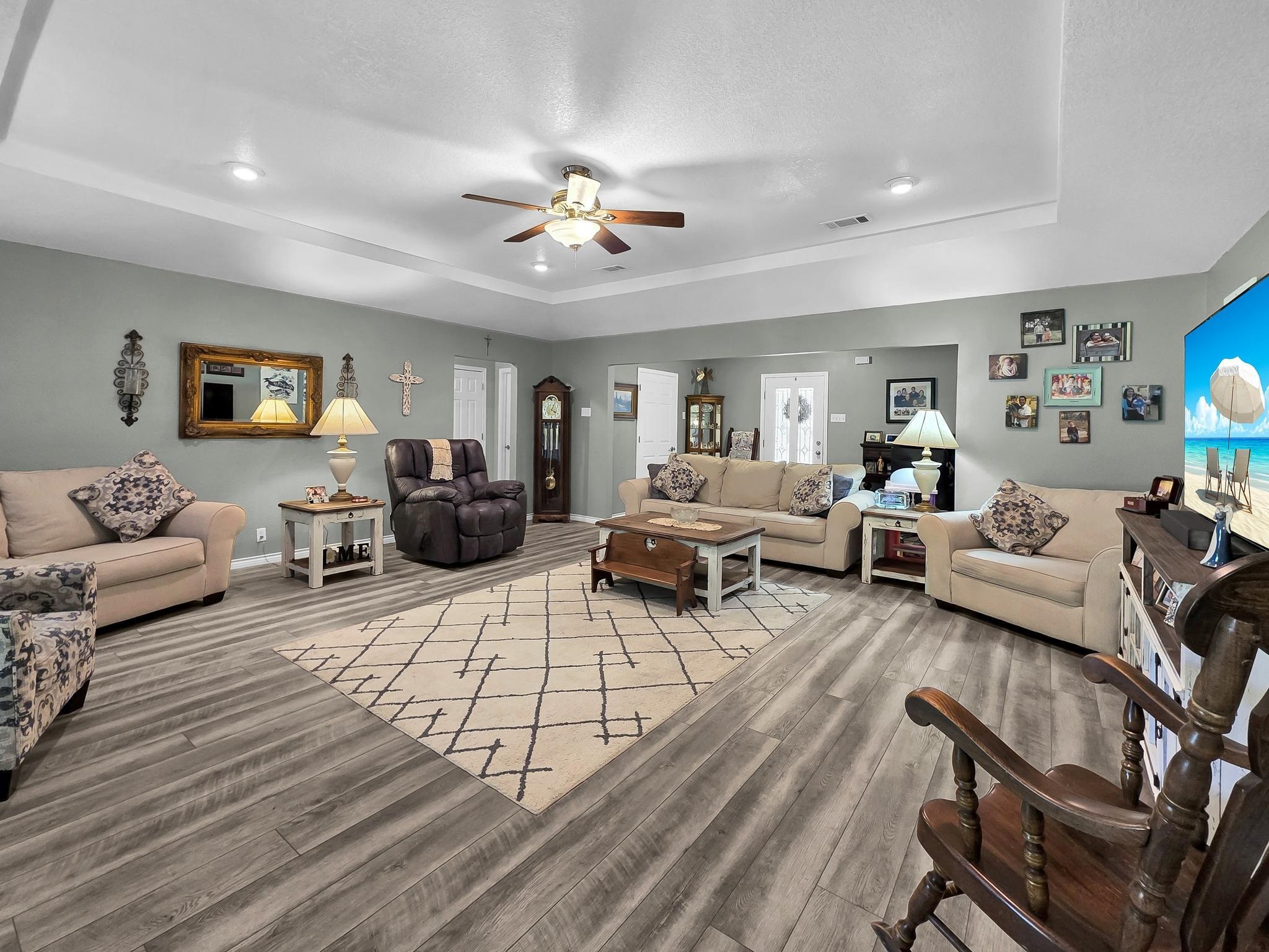 738 Parish Road Orange, TX 77632 - Photo 13 of 45 a living room with furniture ceiling fan and a wooden floor