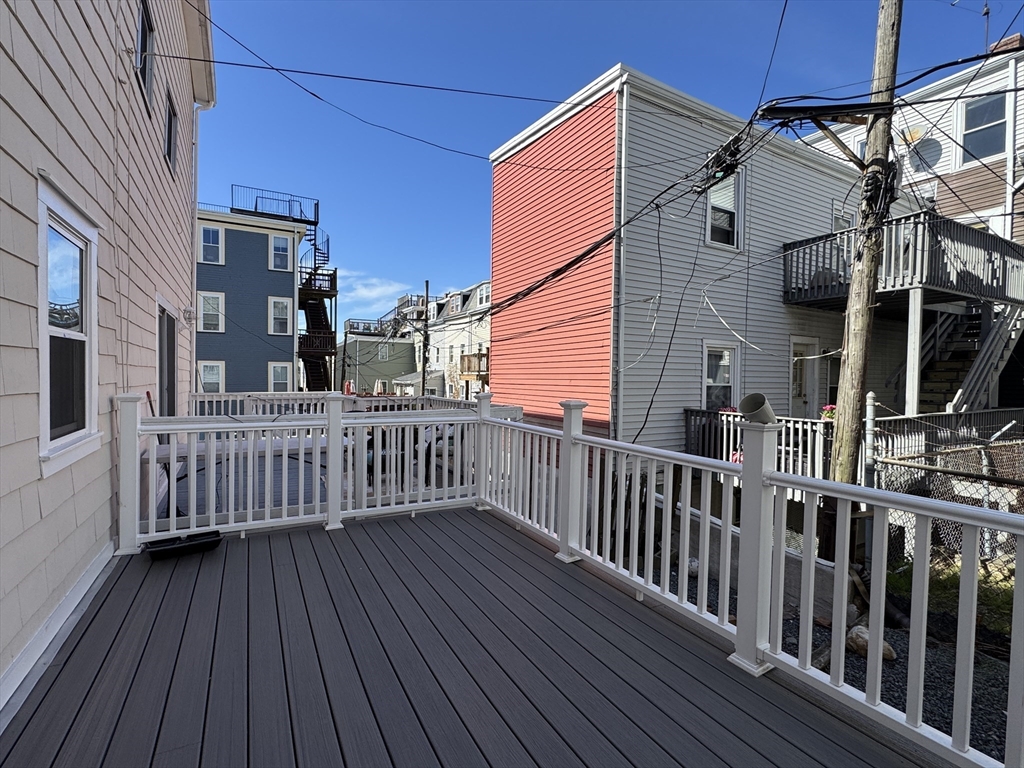 286 Bowen Street Boston, MA 02127 - Photo 11 of 12 a view of a house with wooden deck