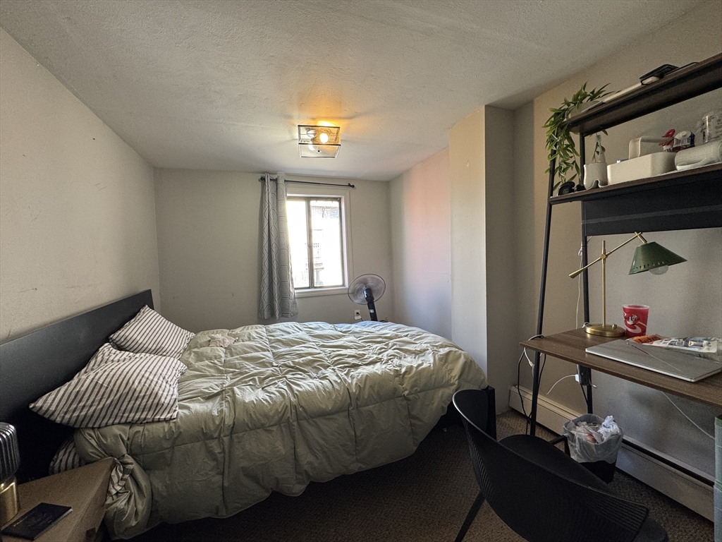 286 Bowen Street Boston, MA 02127 - Photo 6 of 12 a bedroom with a bed and a window