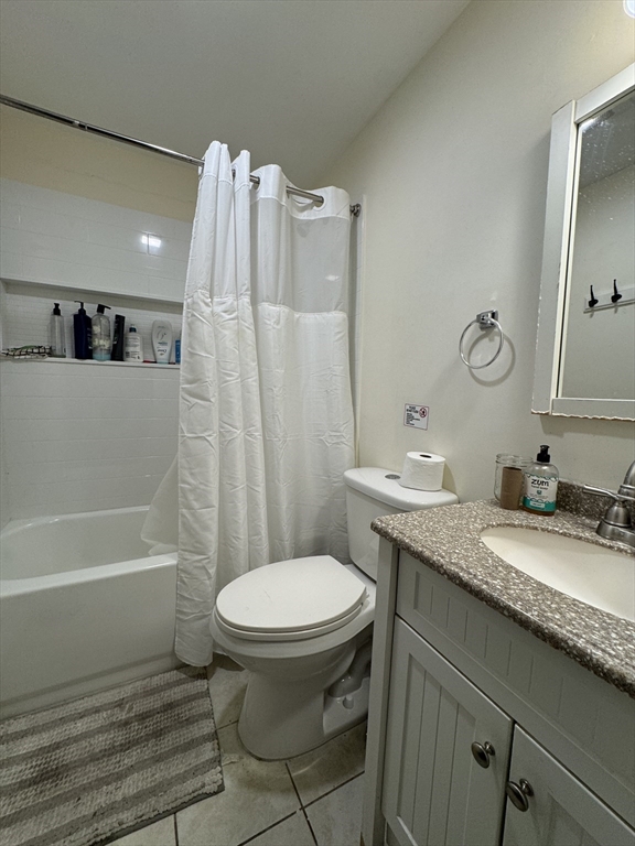 286 Bowen Street Boston, MA 02127 - Photo 9 of 12 a bathroom with a granite countertop sink toilet and shower