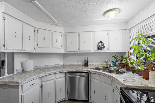 2875 North Hill Field Road, Unit 17 Layton, UT 84041 - Photo 6 of 23 Kitchen featuring white cabinets, stainless steel dishwasher, electric range oven, light countertops, and a textured ceiling