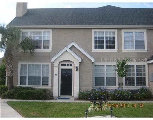5570 Rosehill Road, Unit 202 Sarasota, FL 34233 - Photo 1 of 1 a front view of a house with a yard and plants