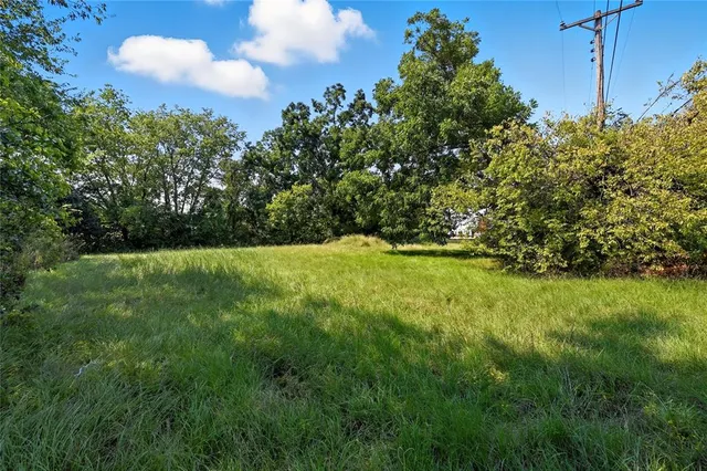a view of outdoor space with deck and yard
