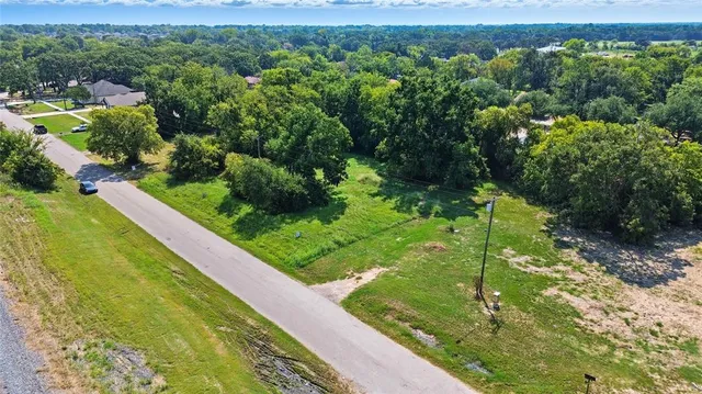 a view of a garden with a building