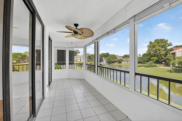 a view of a porch with a floor to ceiling window