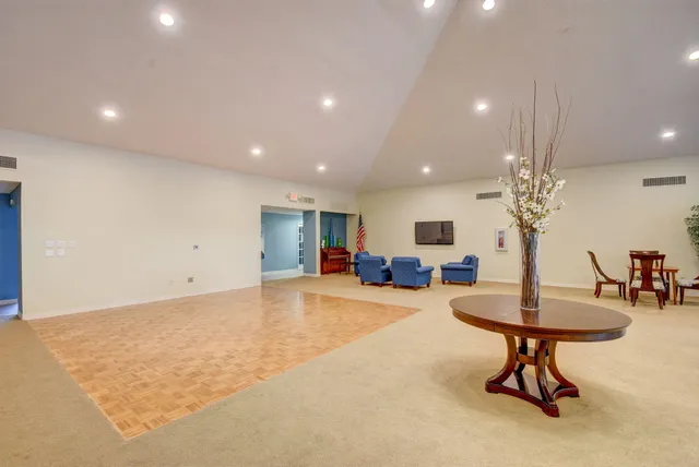 a room with dining table and a chandelier