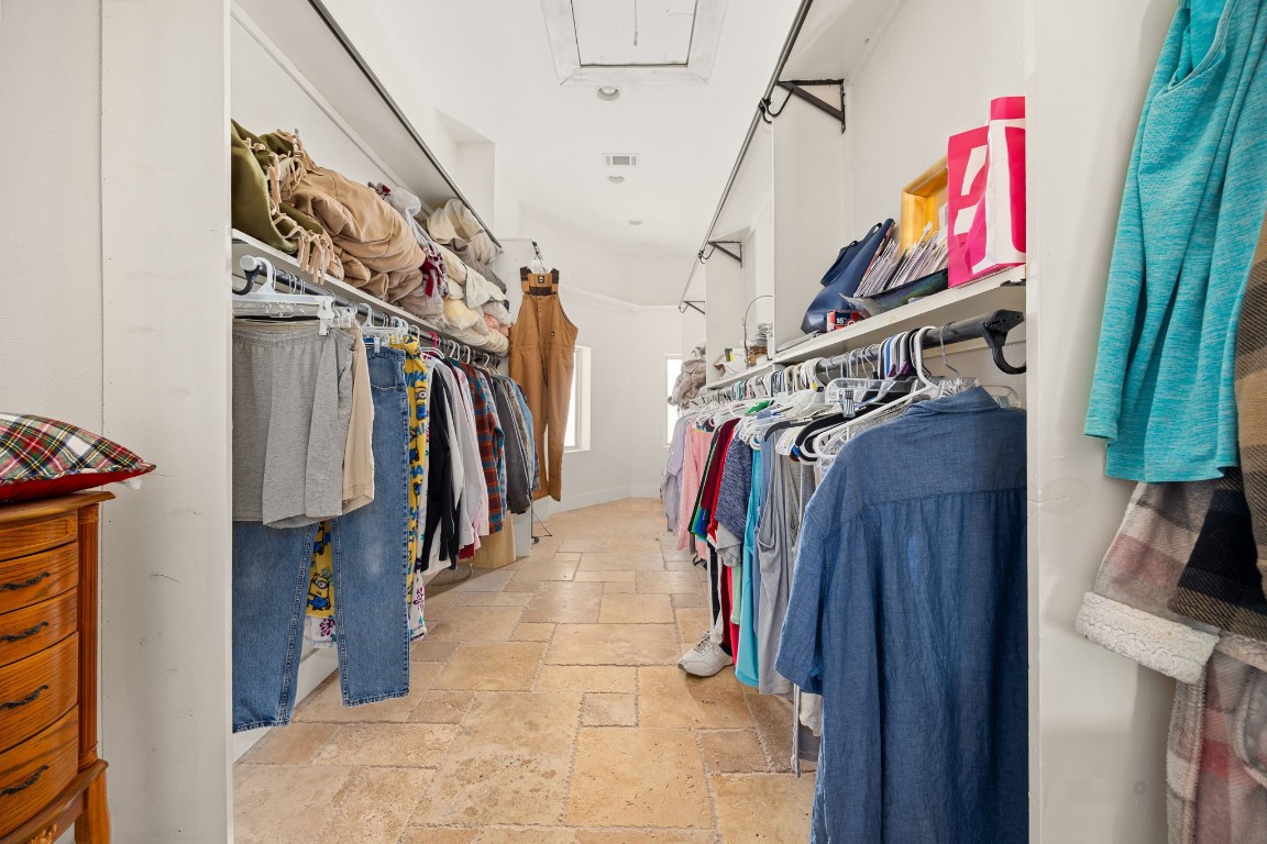 7336 Highland Ranch Road Caldwell, TX 77836 - Photo 13 of 25 a view of walk in closet with clothes and shoes