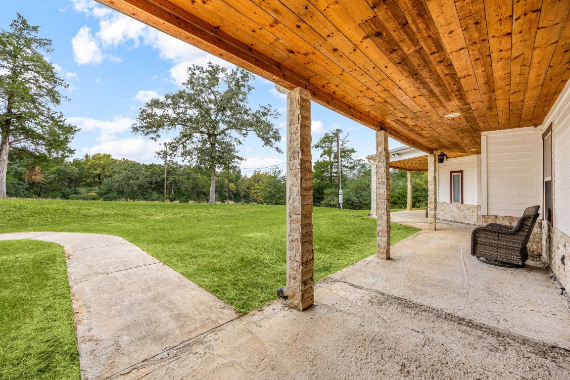 7336 Highland Ranch Road Caldwell, TX 77836 - Photo 19 of 25 a garden view with a seating space