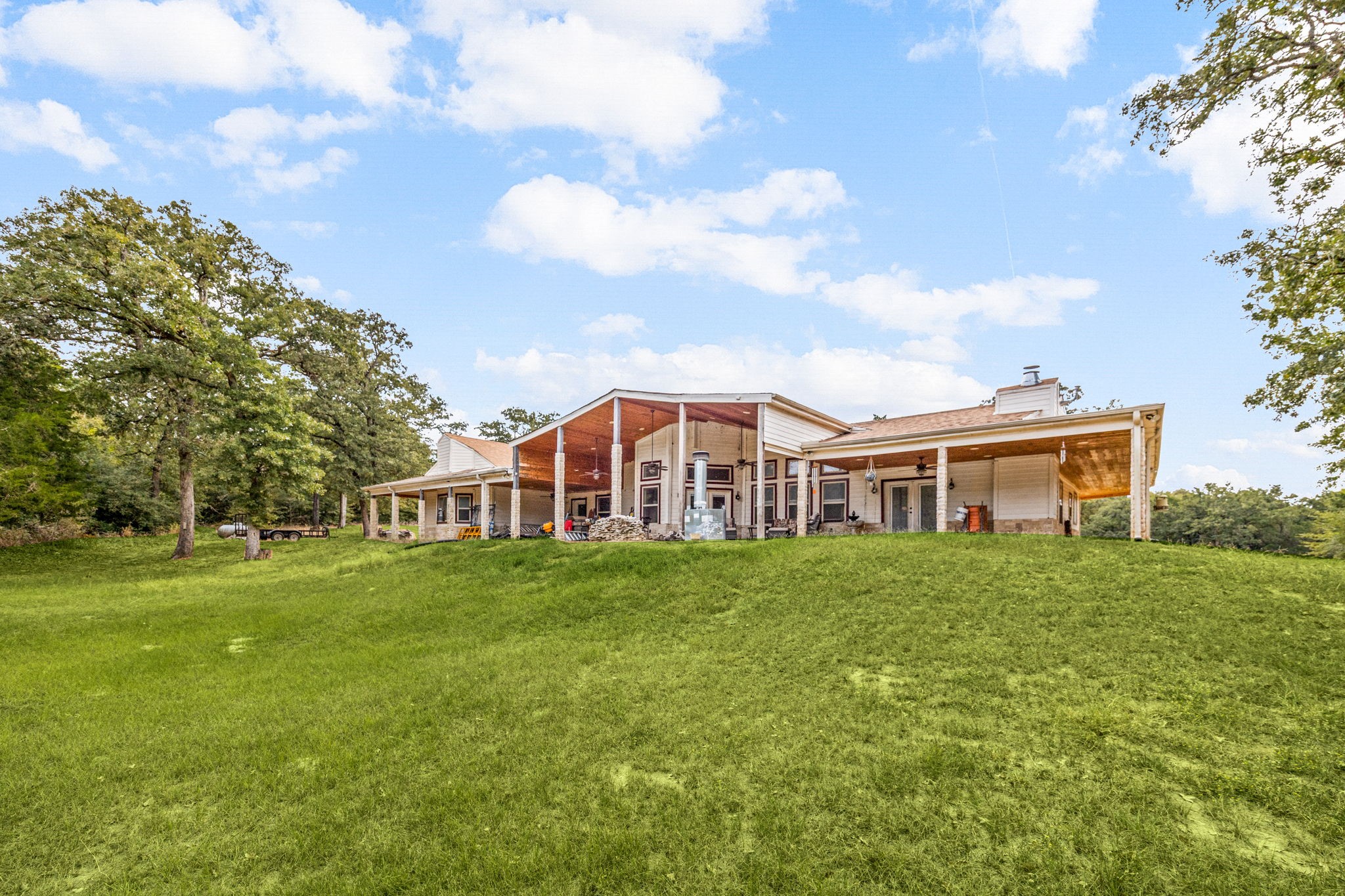 7336 Highland Ranch Road Caldwell, TX 77836 - Photo 21 of 25 a front view of a house with a garden