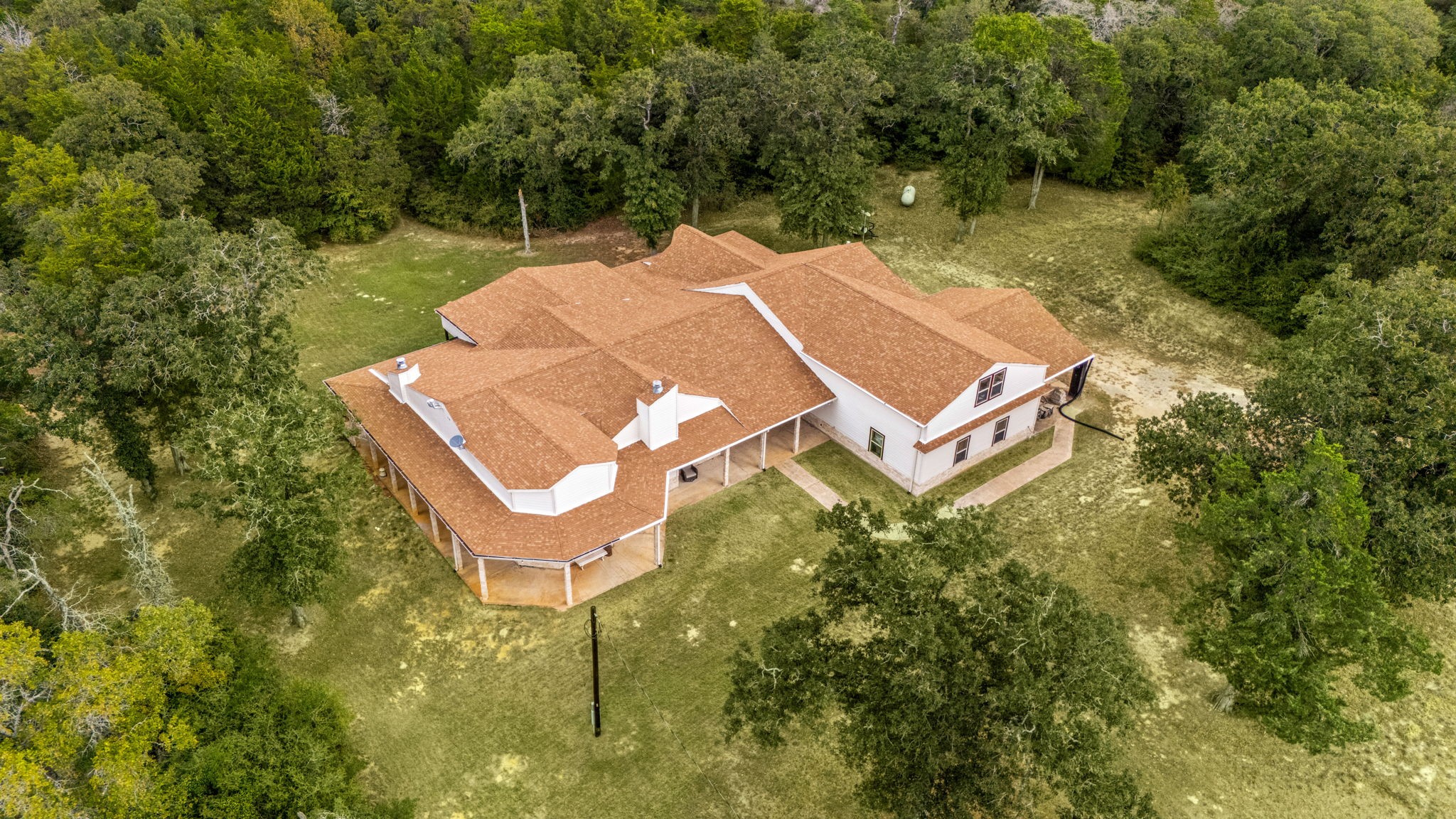 7336 Highland Ranch Road Caldwell, TX 77836 - Photo 3 of 25 an aerial view of a house with swimming pool and outdoor space