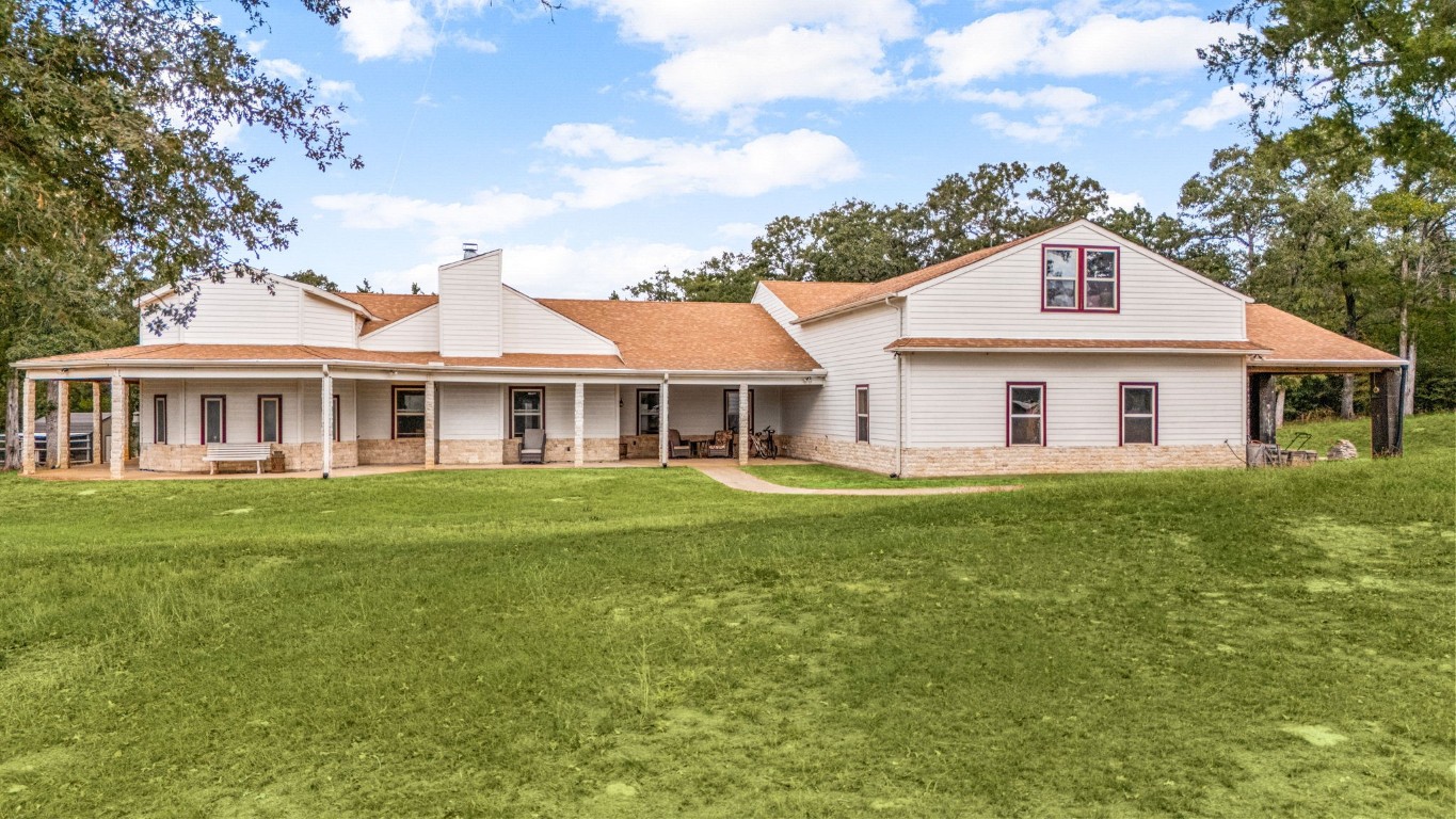 7336 Highland Ranch Road Caldwell, TX 77836 - Photo 4 of 25 a front view of a house with a garden