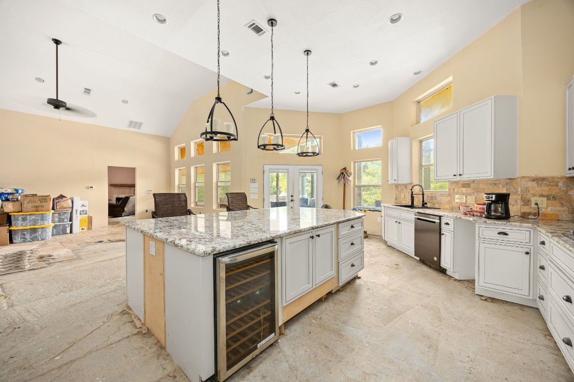 7336 Highland Ranch Road Caldwell, TX 77836 - Photo 7 of 25 a kitchen with stainless steel appliances granite countertop a stove a sink and white cabinets