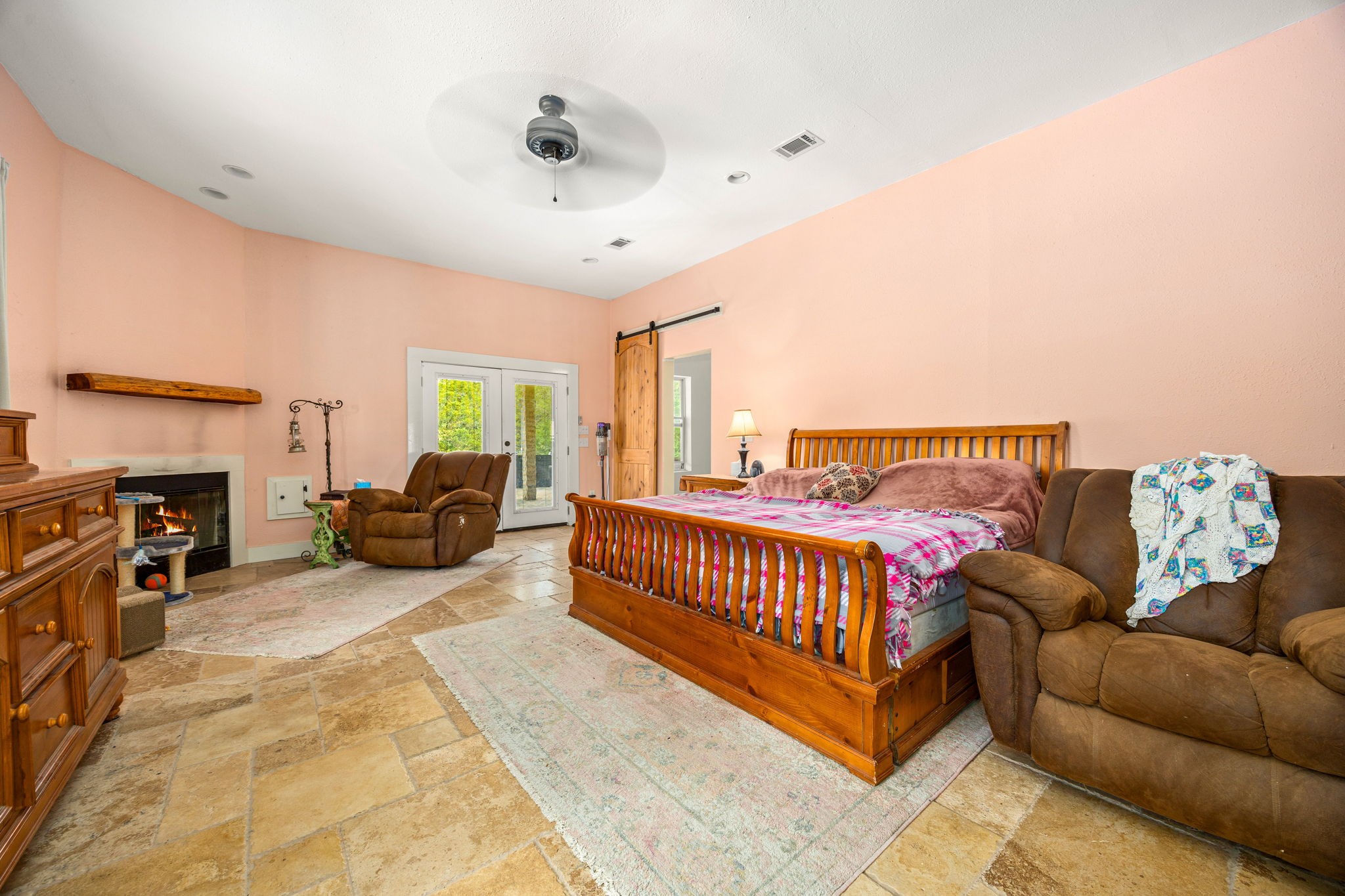 7336 Highland Ranch Road Caldwell, TX 77836 - Photo 10 of 25 a spacious bedroom with a bed and a couch