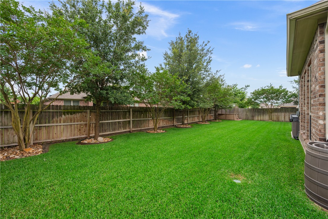 3085 Archer Circle Bryan, TX 77808 - Photo 26 of 31 a view of a yard with a wooden fence