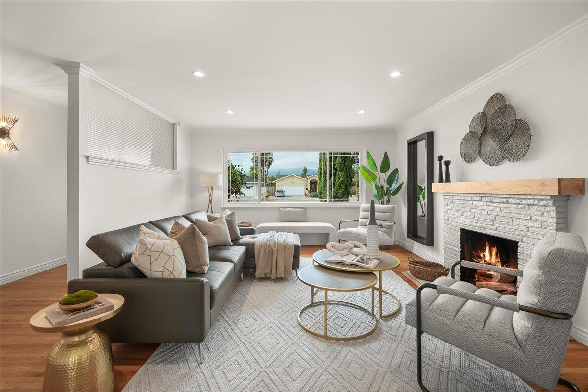 7669 Rainbow Drive Cupertino, CA 95014 - Photo 11 of 37 a living room with furniture and a fireplace