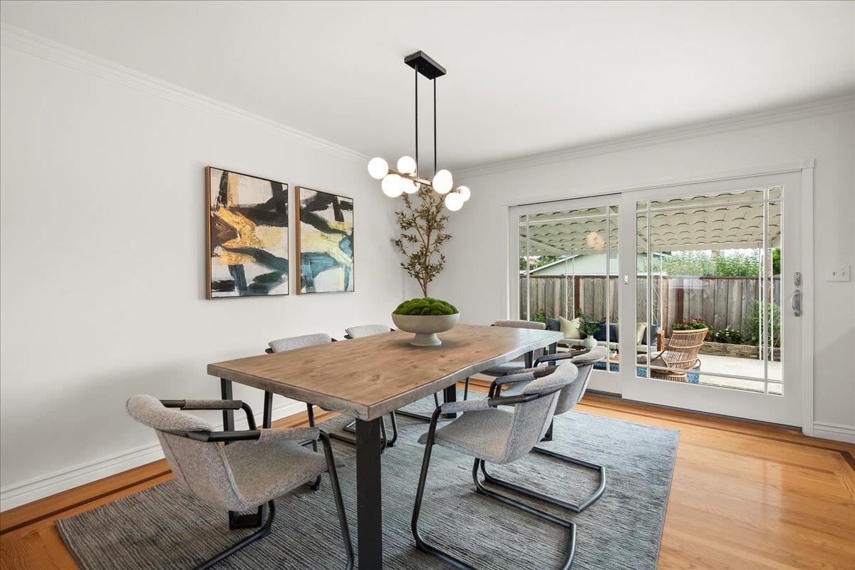 7669 Rainbow Drive Cupertino, CA 95014 - Photo 14 of 37 a view of a dining room with furniture wooden floor and chandelier