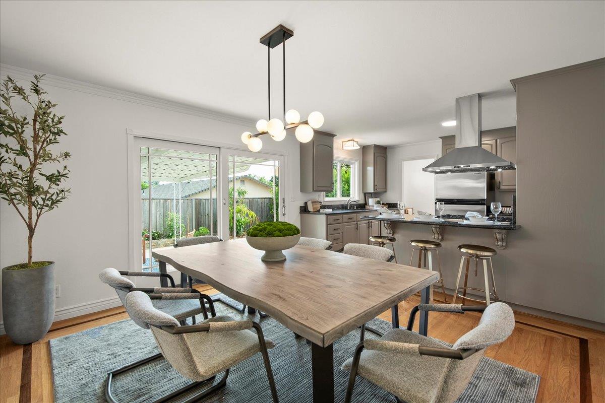 7669 Rainbow Drive Cupertino, CA 95014 - Photo 15 of 37 a view of a dining room with furniture window and wooden floor