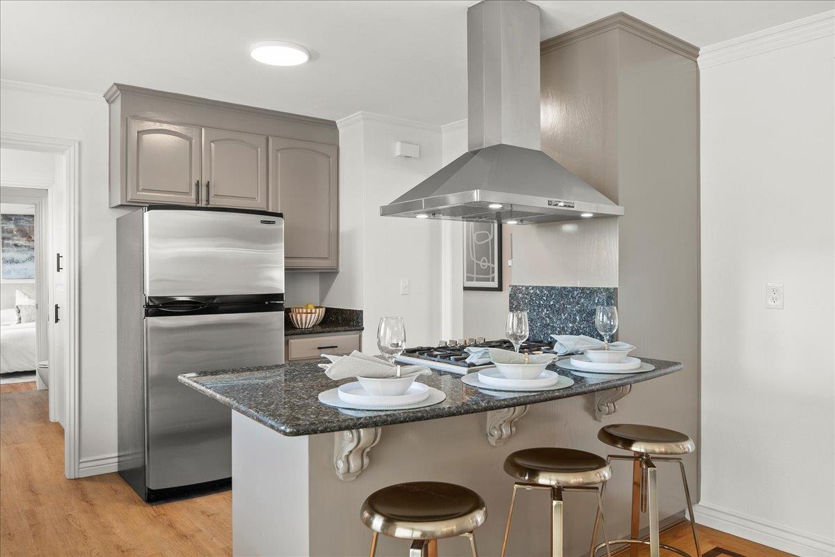 7669 Rainbow Drive Cupertino, CA 95014 - Photo 17 of 37 a kitchen with a table and chairs in it