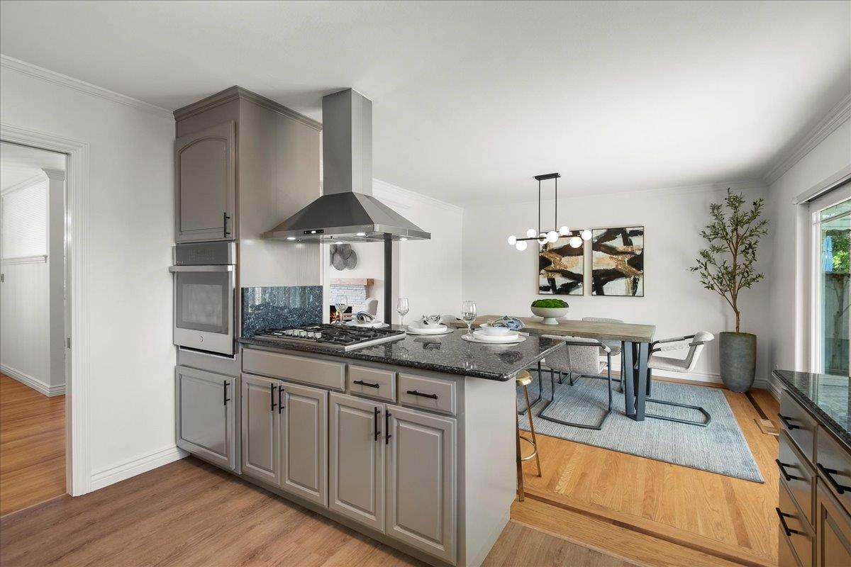 7669 Rainbow Drive Cupertino, CA 95014 - Photo 19 of 37 a kitchen with stainless steel appliances granite countertop a stove and a sink