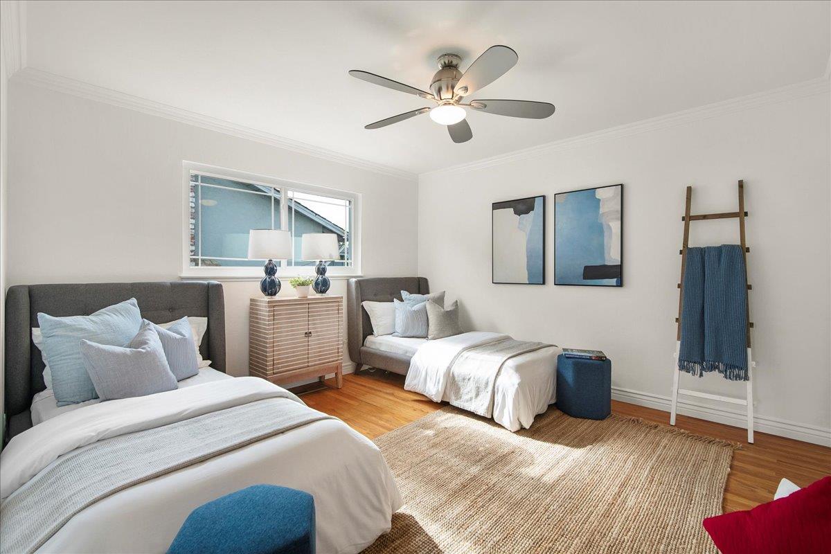 7669 Rainbow Drive Cupertino, CA 95014 - Photo 25 of 37 a bedroom with two beds and a chandelier