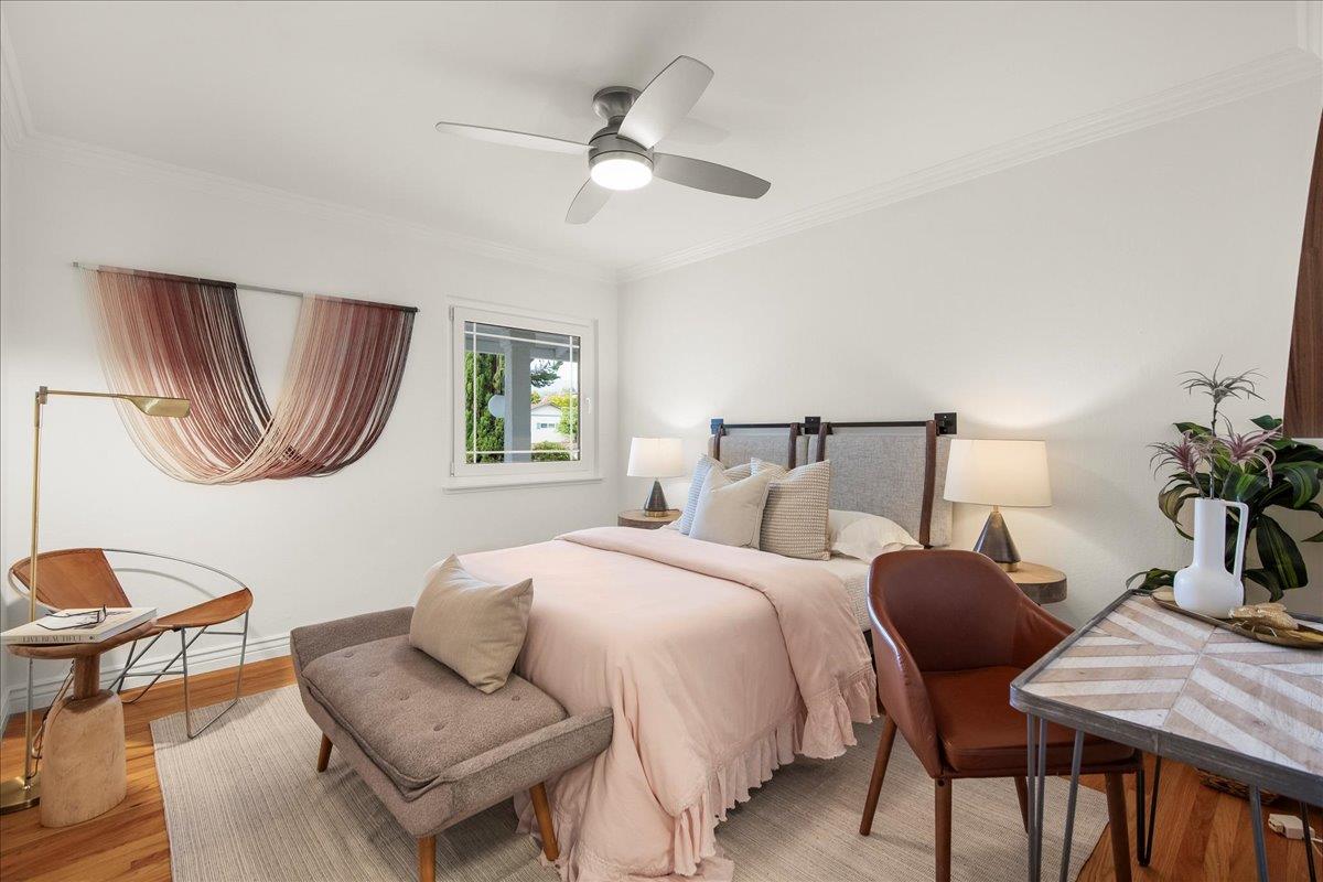 7669 Rainbow Drive Cupertino, CA 95014 - Photo 27 of 37 a bedroom with a bed and a chair
