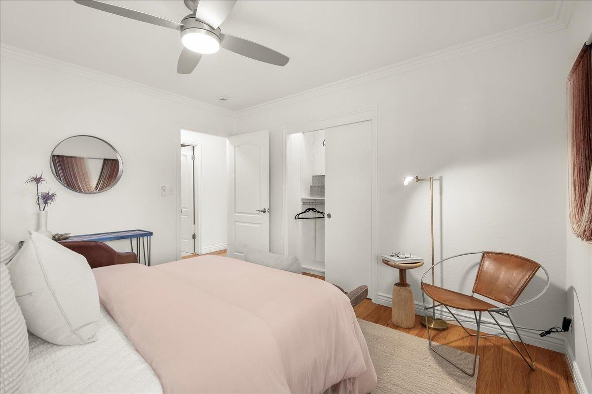 7669 Rainbow Drive Cupertino, CA 95014 - Photo 28 of 37 a bedroom with a bed a chair and potted plant