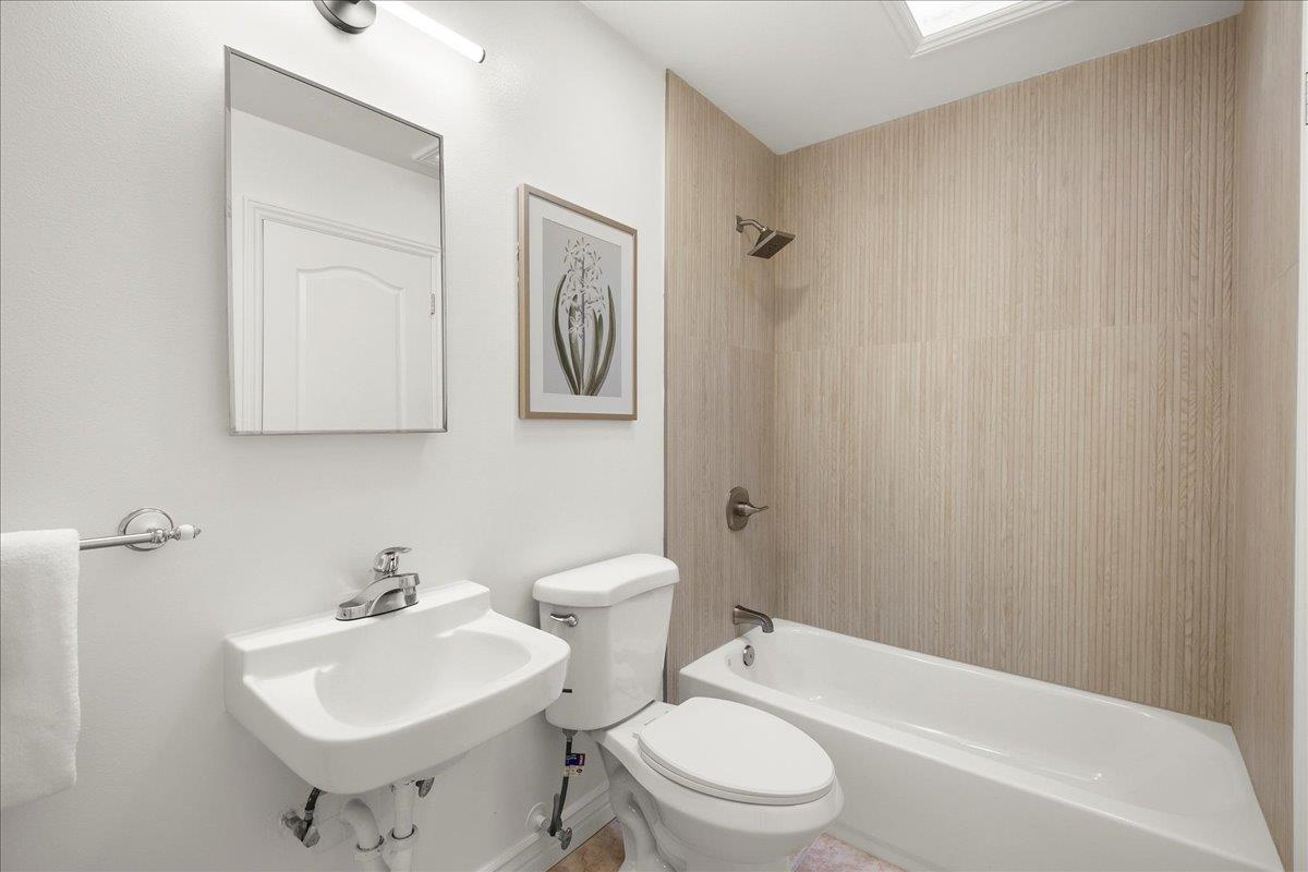 7669 Rainbow Drive Cupertino, CA 95014 - Photo 30 of 37 a bathroom with a toilet sink and mirror