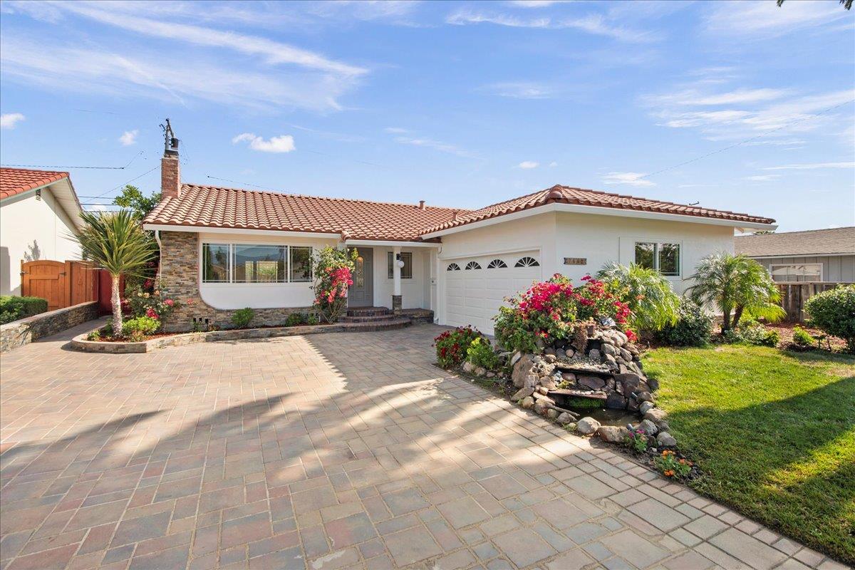 7669 Rainbow Drive Cupertino, CA 95014 - Photo 5 of 37 a front view of a house with garden
