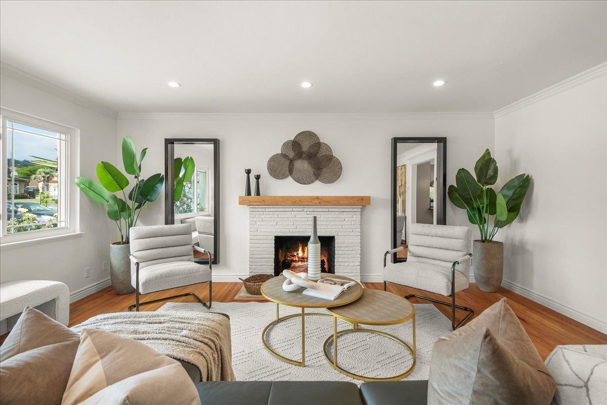 7669 Rainbow Drive Cupertino, CA 95014 - Photo 10 of 37 a living room with furniture and a fireplace