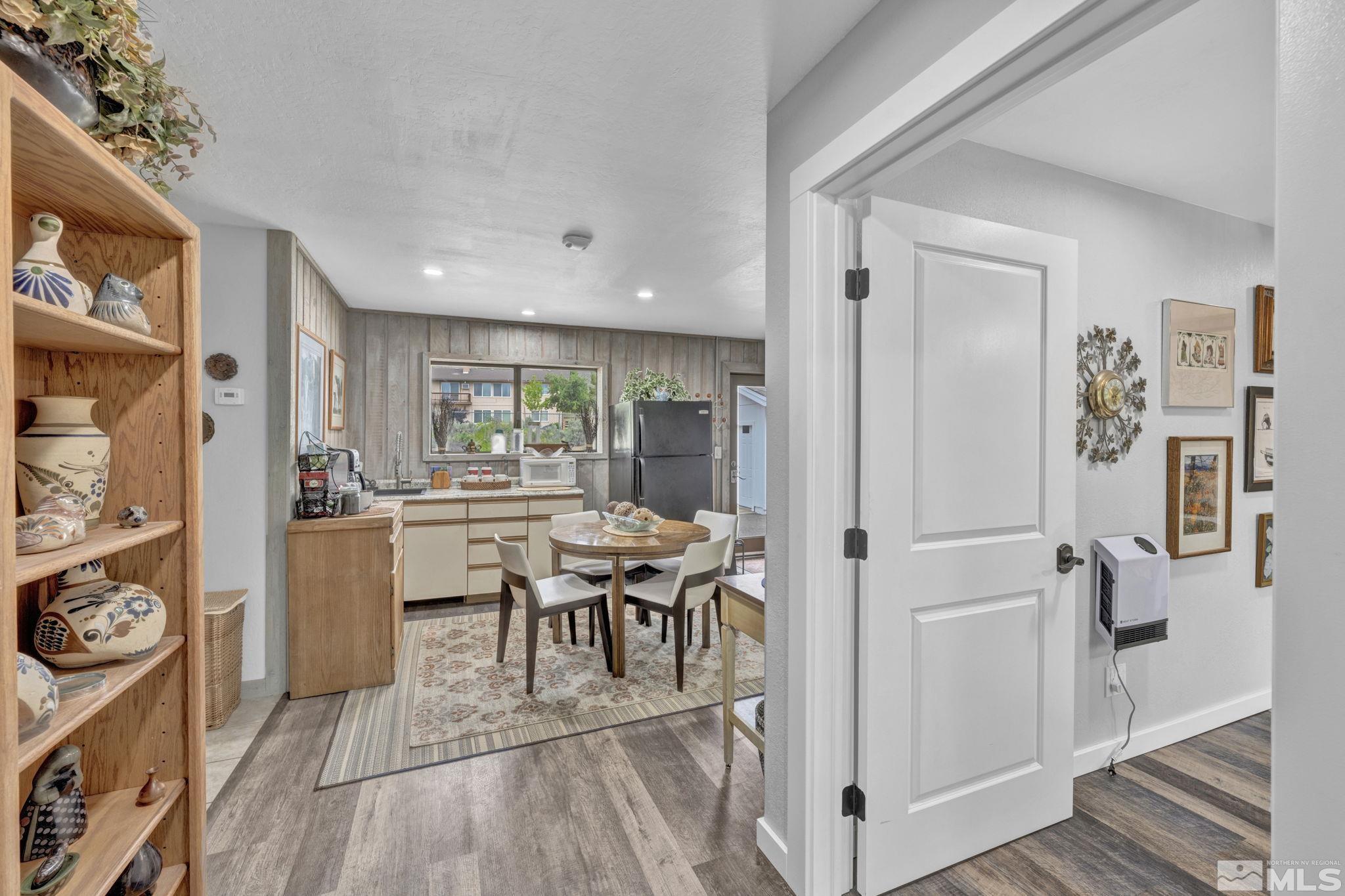 310 Ruby Lane Carson City, NV 89706 - Photo 11 of 40 a view of a dining room with furniture window and wooden floor