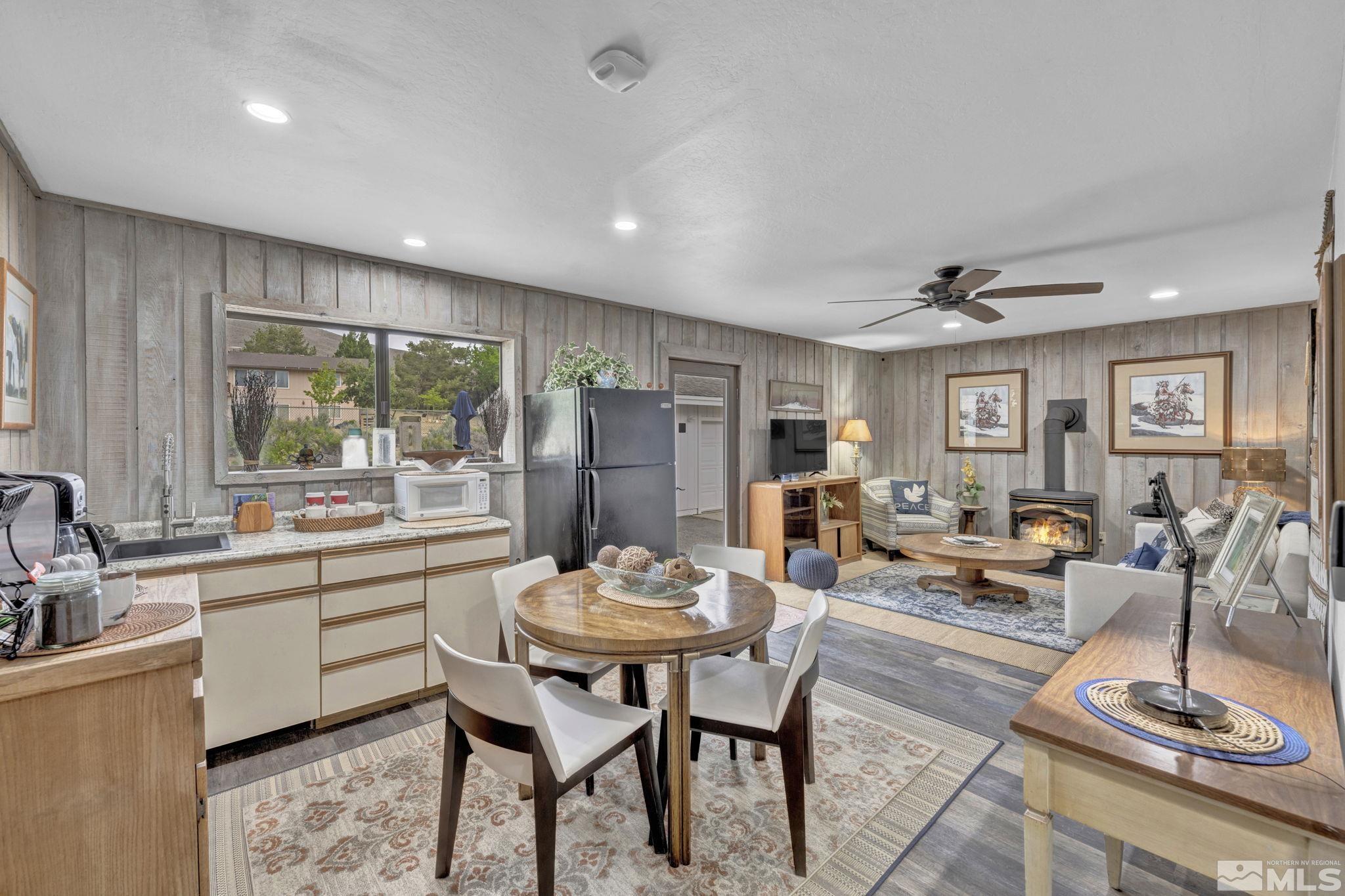 310 Ruby Lane Carson City, NV 89706 - Photo 12 of 40 a living room with stainless steel appliances furniture a rug and a kitchen view