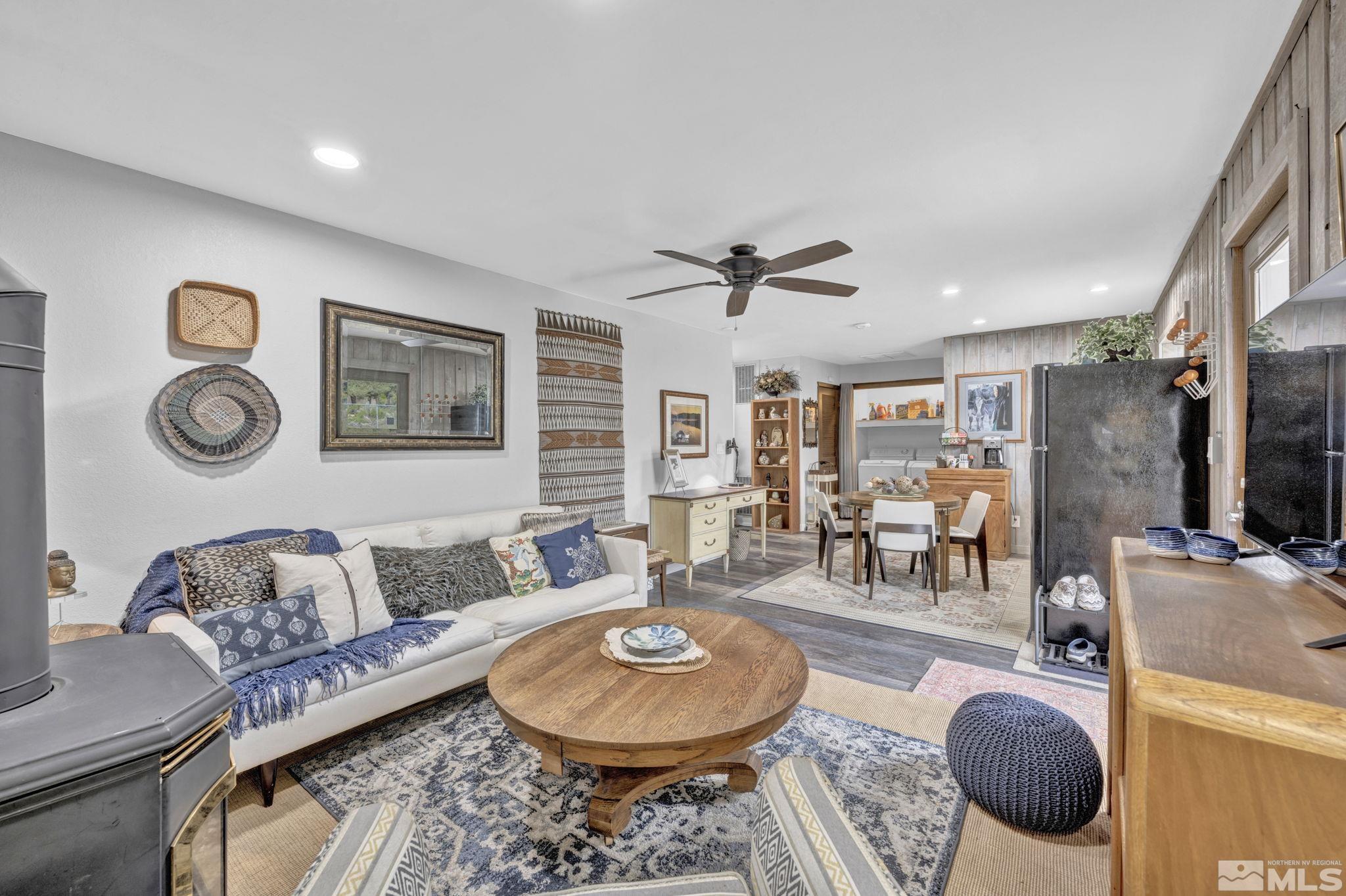 310 Ruby Lane Carson City, NV 89706 - Photo 15 of 40 a living room with furniture a rug and wall paintings