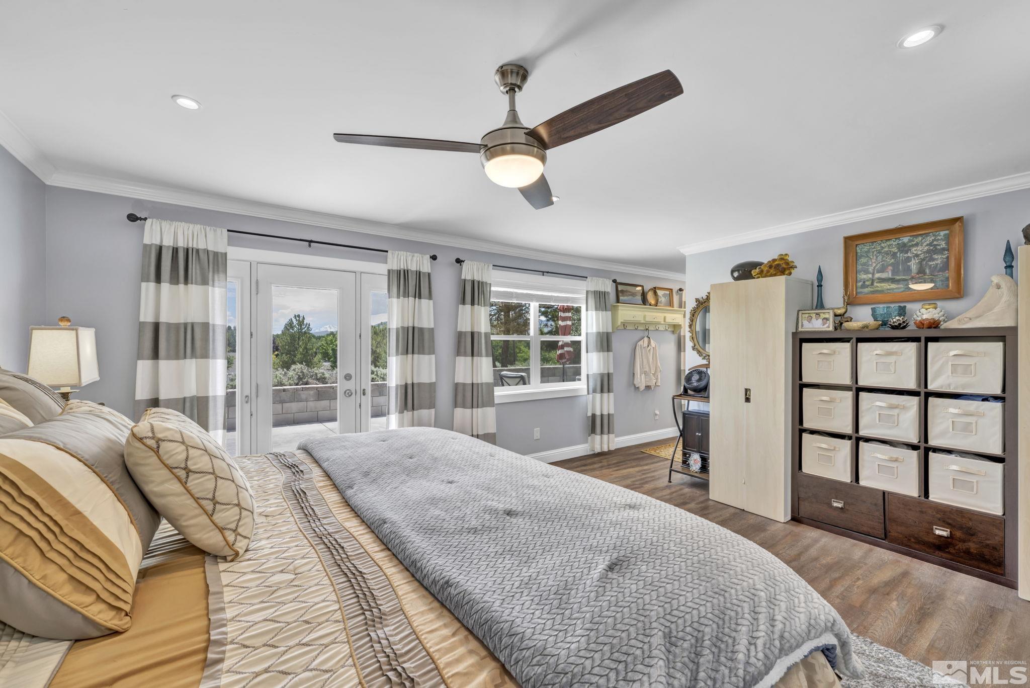 310 Ruby Lane Carson City, NV 89706 - Photo 19 of 40 a bedroom with a large bed and a large window