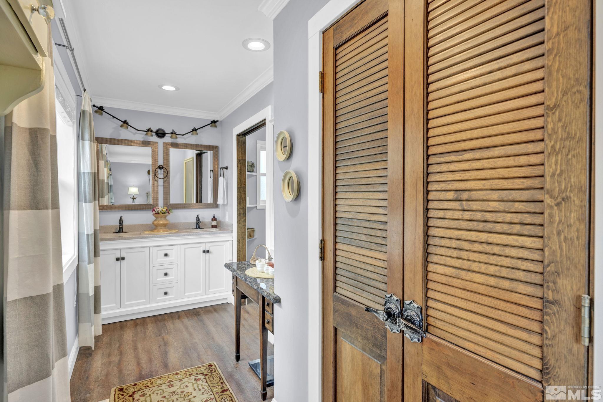310 Ruby Lane Carson City, NV 89706 - Photo 20 of 40 a bathroom with a sink a mirror and a shower