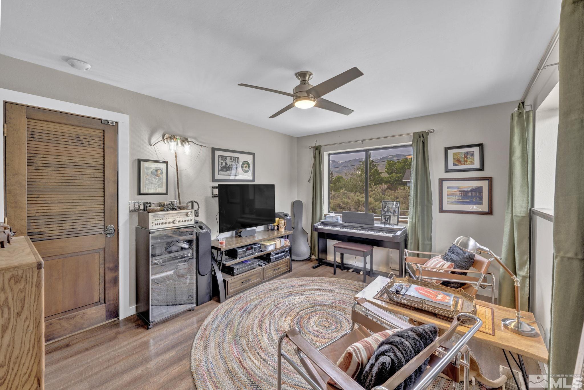 310 Ruby Lane Carson City, NV 89706 - Photo 25 of 40 a living room with furniture and a flat screen tv