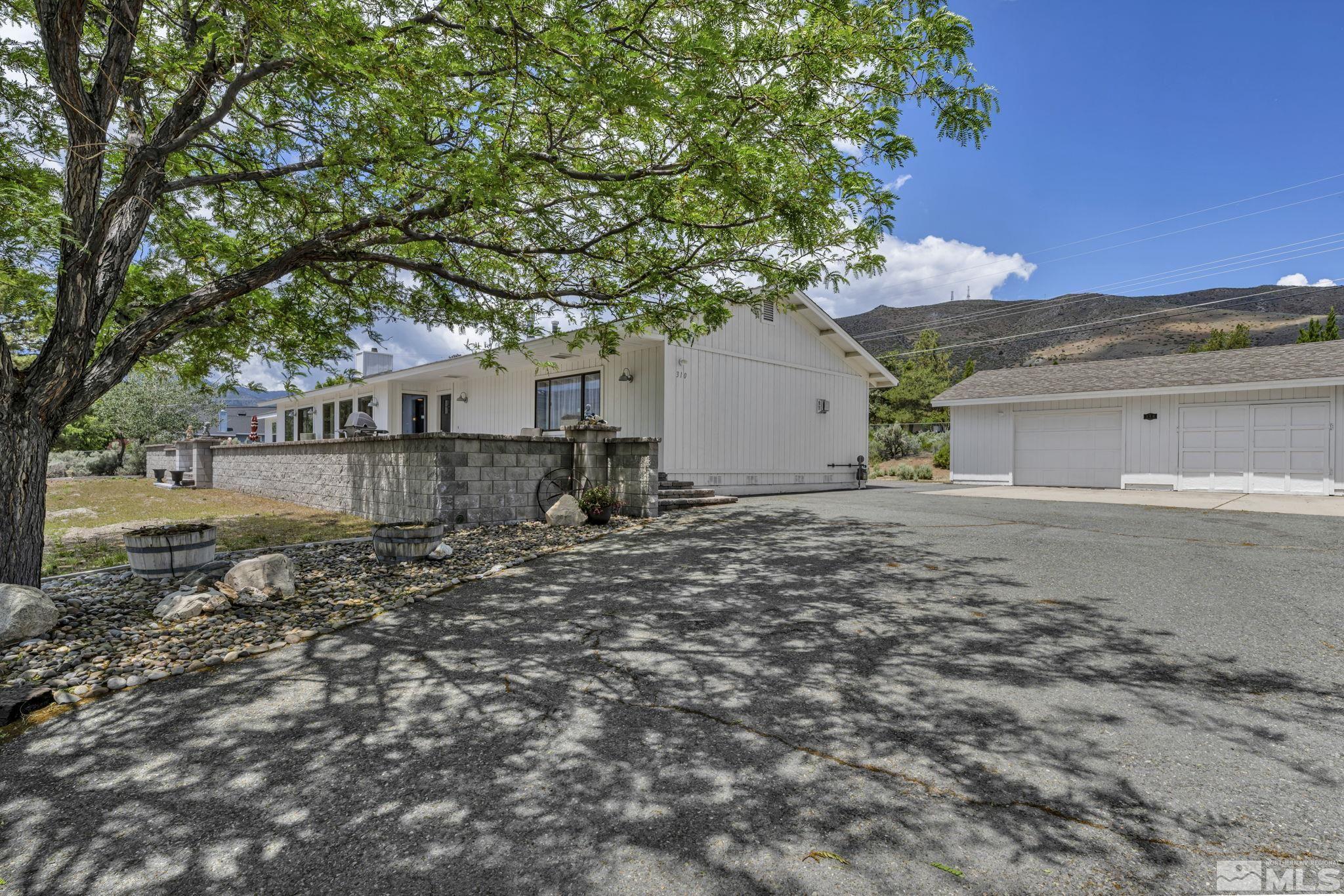 310 Ruby Lane Carson City, NV 89706 - Photo 29 of 40 a front view of a house with a yard