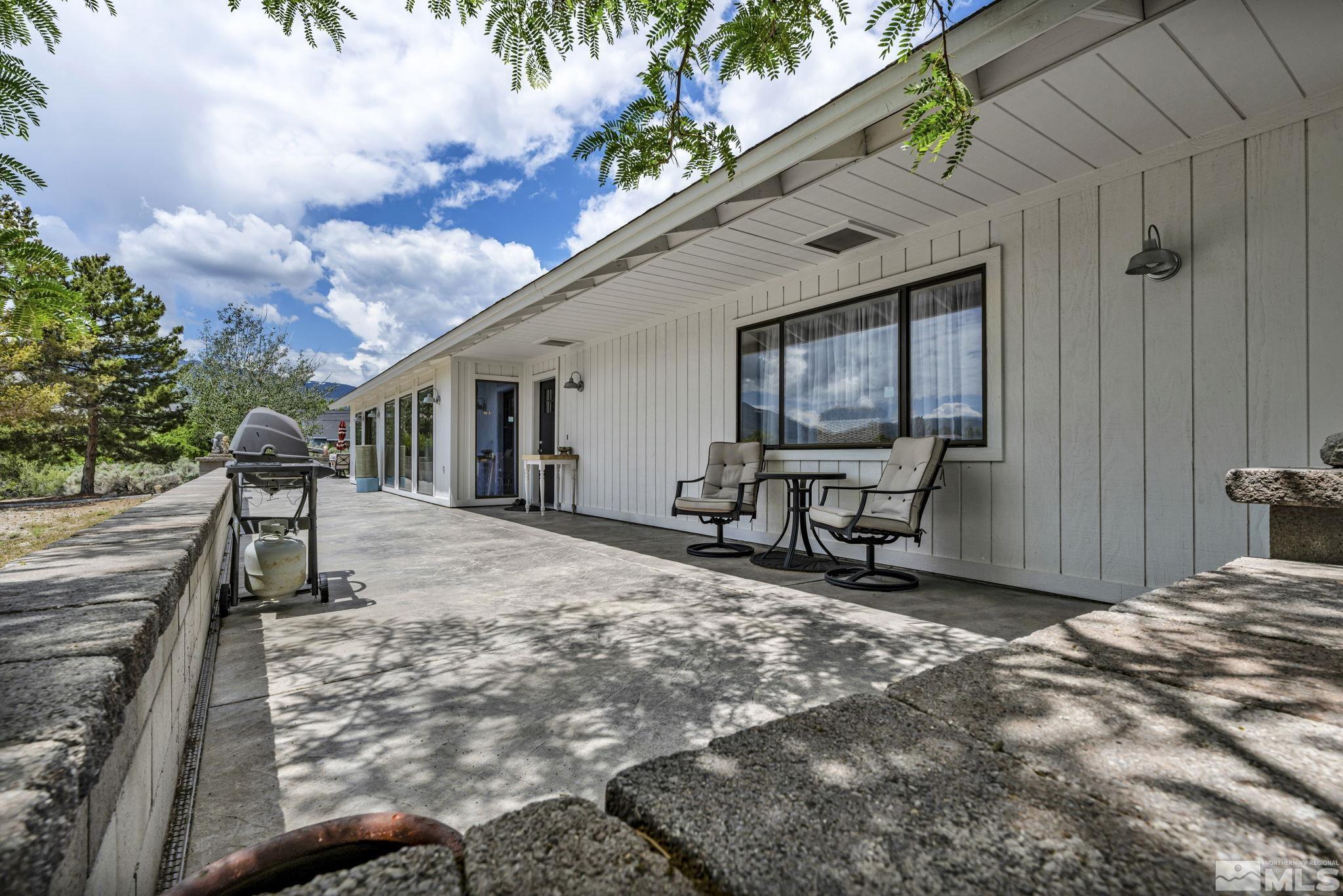 310 Ruby Lane Carson City, NV 89706 - Photo 31 of 40 a view of a house with backyard and sitting area