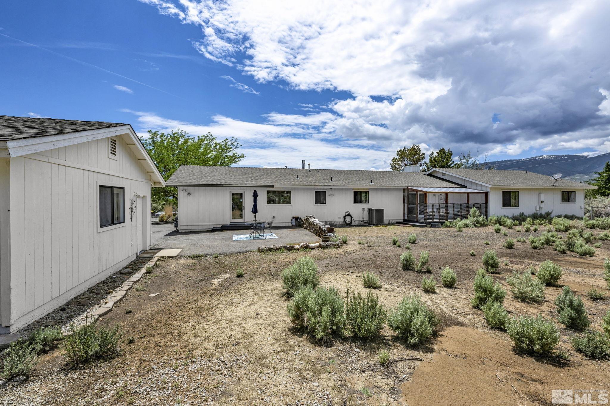 310 Ruby Lane Carson City, NV 89706 - Photo 37 of 40 a front view of a house with a yard