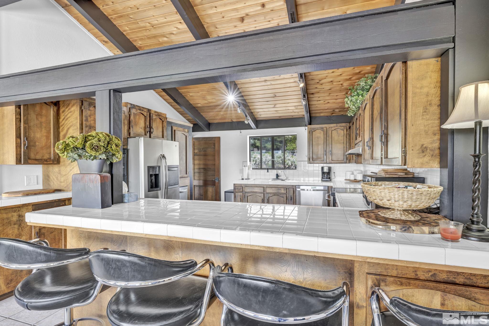 310 Ruby Lane Carson City, NV 89706 - Photo 6 of 40 a kitchen with a stove and a large window