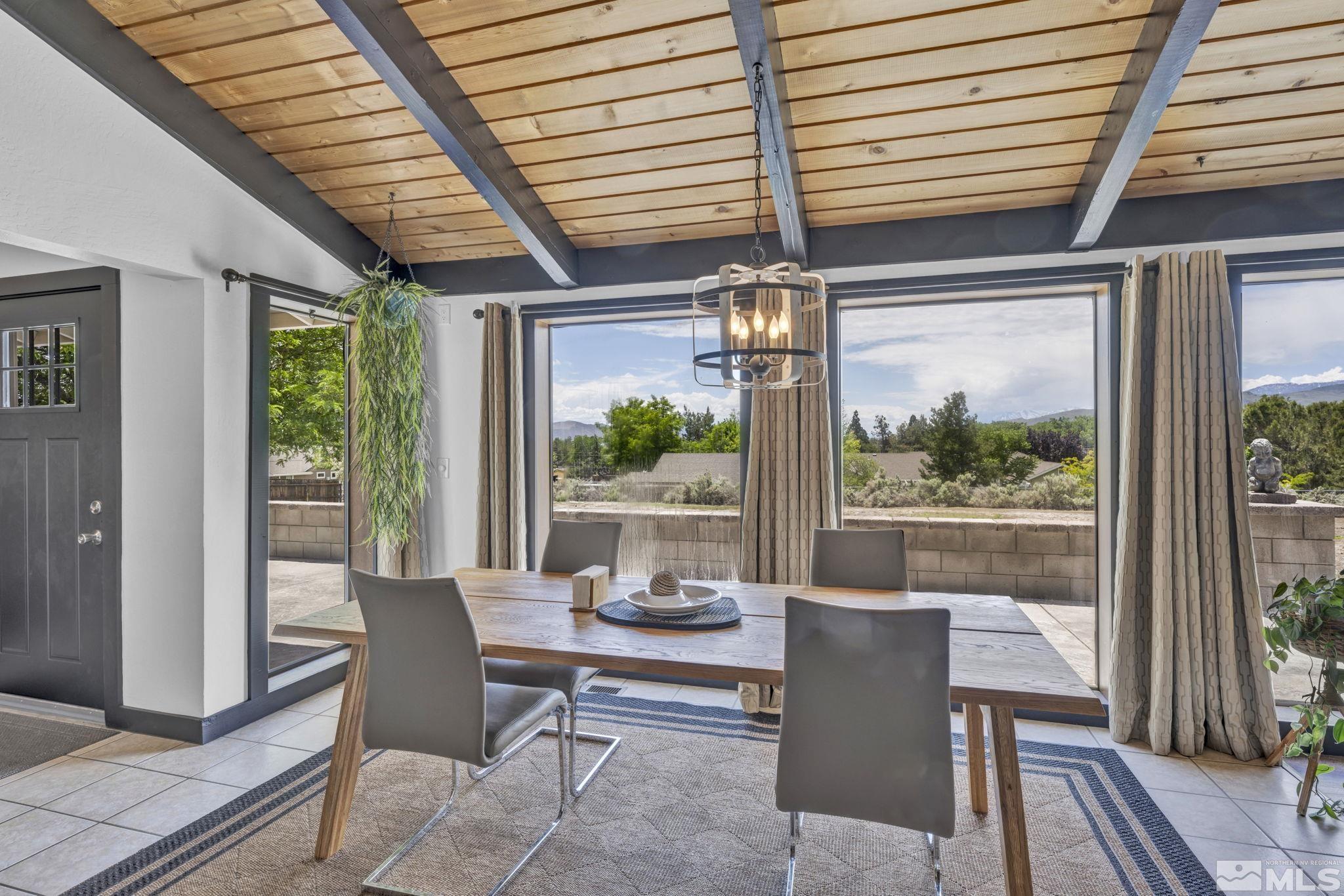 310 Ruby Lane Carson City, NV 89706 - Photo 10 of 40 a dining room with furniture wooden floor and a potted plant