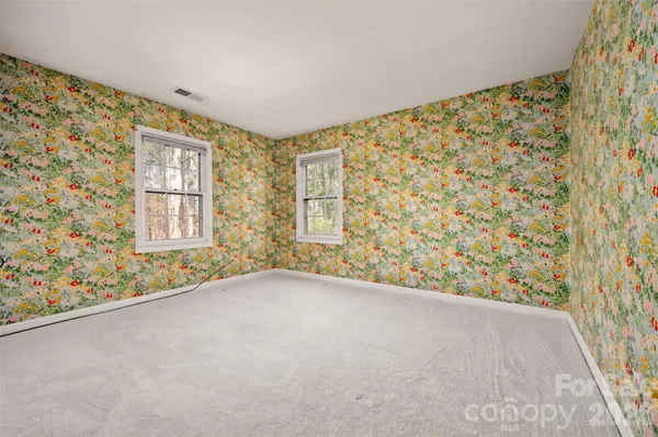 an empty room with windows