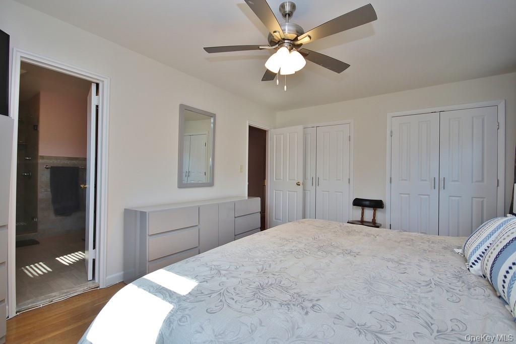 47 Fuller Road Briarcliff Manor, NY 10510 - Photo 14 of 34 Ceiling fan with light and two closets in Primary bedroom
