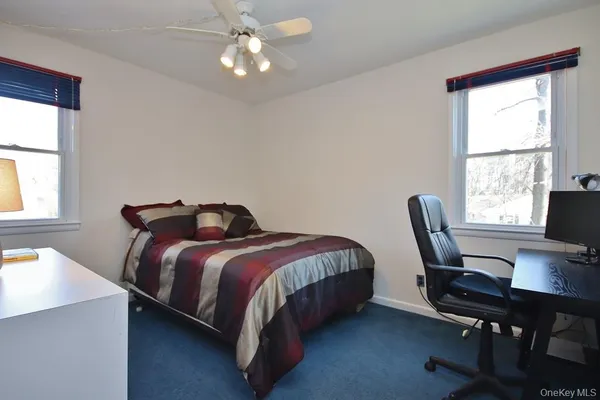 a bed room with a bed and a desk