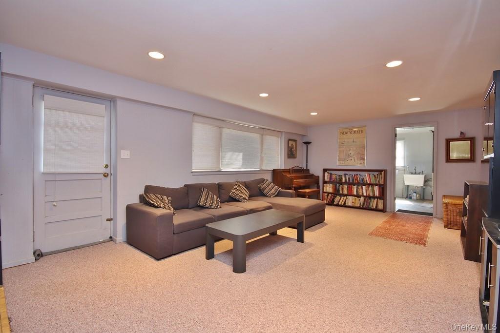 47 Fuller Road Briarcliff Manor, NY 10510 - Photo 24 of 34 Family Room on lower level has wall to wall carpet and door to outside